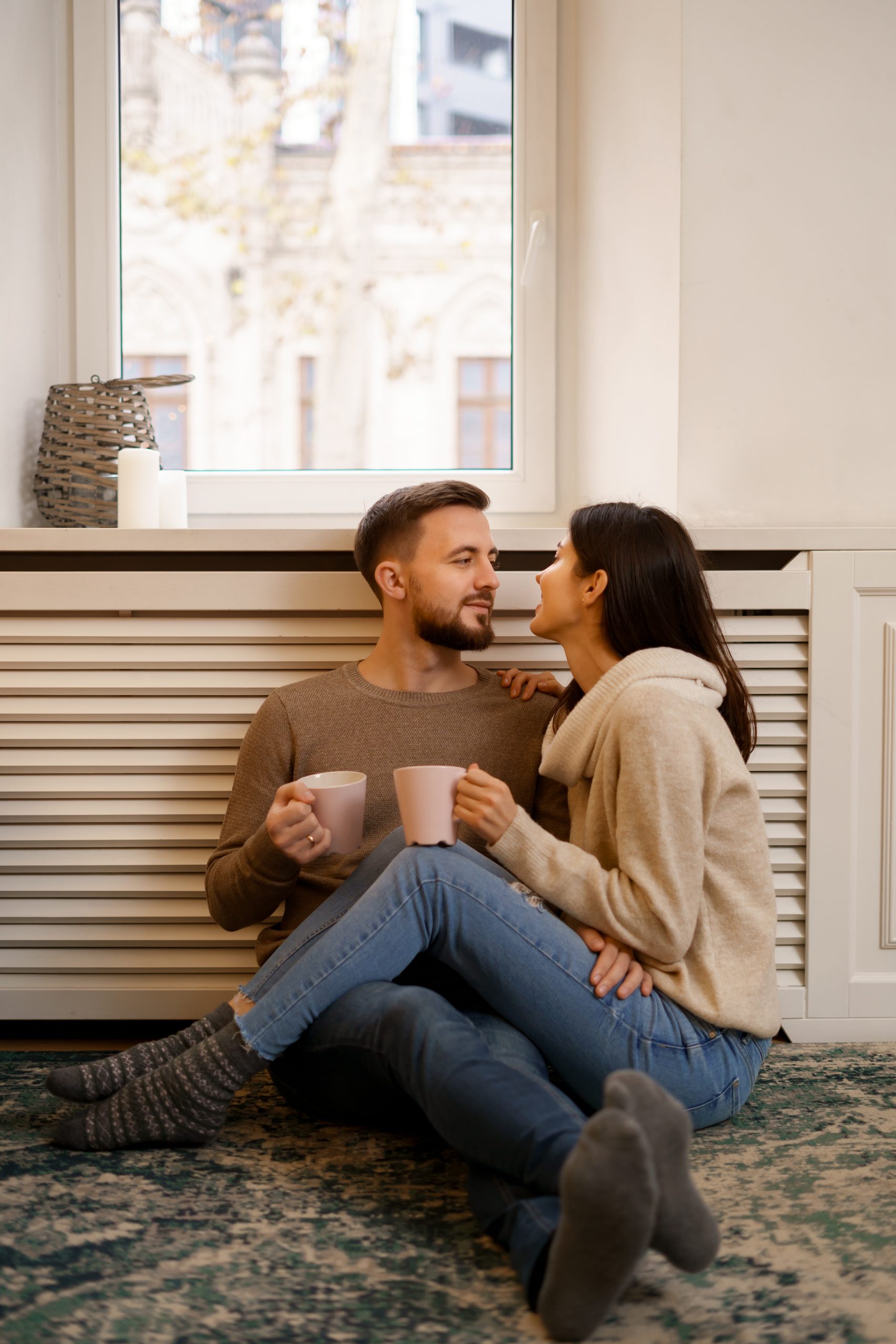 romantic couple home attractive young woman handsome man are enjoying spending time scaled